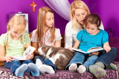 Mother is reading a book