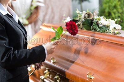 Mourning Woman at Funeral with coffin