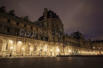 PARIS - JAN 8 : Louvre museum at dusk in Paris, France