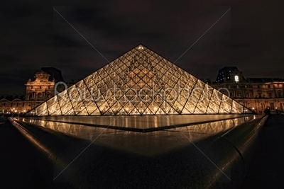 PARIS - JAN 8 : Louvre museum at dusk in Paris, France