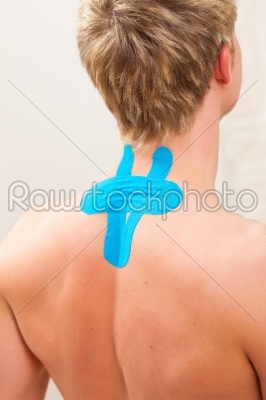Patient at the physiotherapy with tape