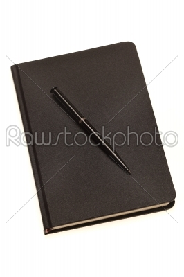 Pen on a dark notebook