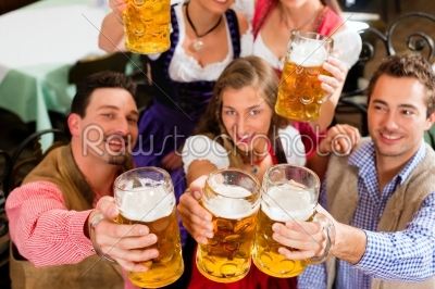 People drinking beer in Bavarian pub