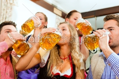 People drinking beer in Bavarian pub