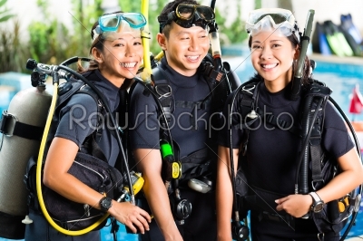 People in diving school, students and master