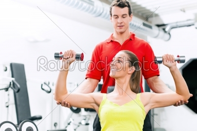 Personal trainer in gym for better fitness