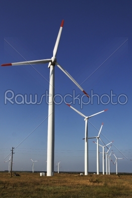 Photo of Wind power installation in sunny day  