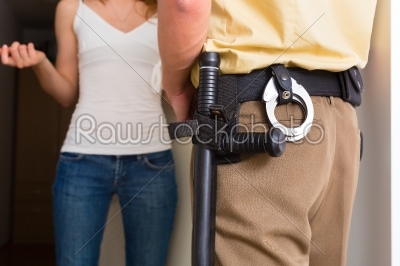 Police officer interrogation woman at front door