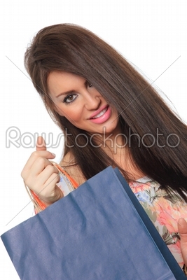 Portrait of stunning young woman carrying shopping bags