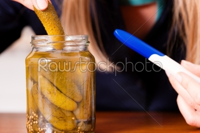 pregnant woman eating pickles 