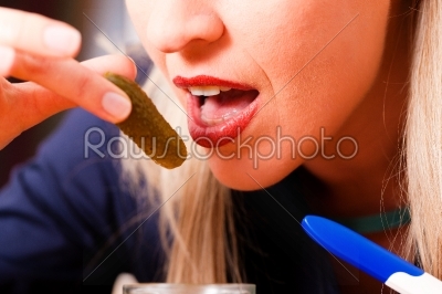 pregnant woman eating pickles 