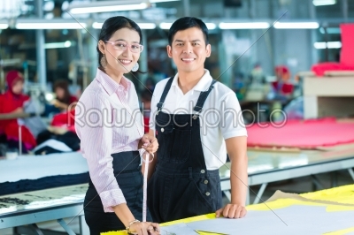 Production manager and designer in Asian factory