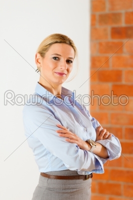 Realtor standing in empty apartment