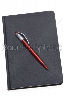 Red Pen on a dark notebook
