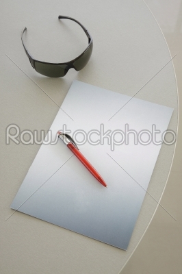 Red Pen on a grey notebook 