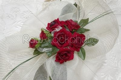 Red rose on a background white silk 