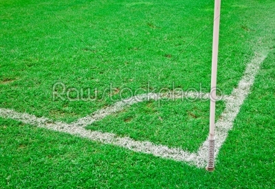 shot of a soccer field with a corner flag pole. 