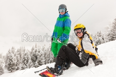 Skier and Snowboarder on mountain