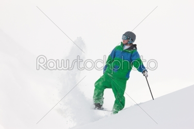 Skier dusting snow