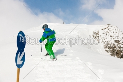 Skier walking up the hill on skier