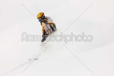 Snowboarder skiing downhill