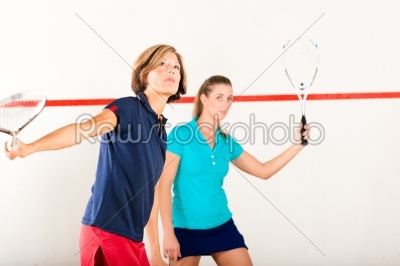 Squash racket sport in gym, women competition