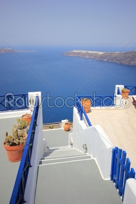 Staircases leading down to the beautiful bay with clear blue  sea
