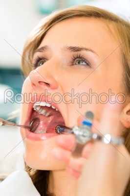 Syringe - dentist gives anesthesia