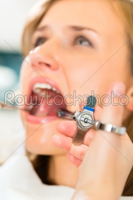 Syringe - dentist gives anesthesia