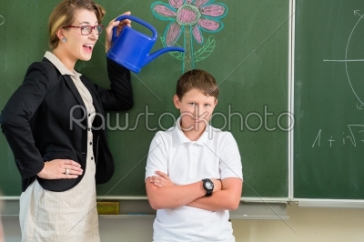 Teacher or docent motivate student or pupil or boy in front of a