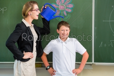 Teacher or docent motivate student or pupil or boy in front of a