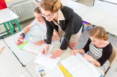 Teacher teaching students  geography lessons in school