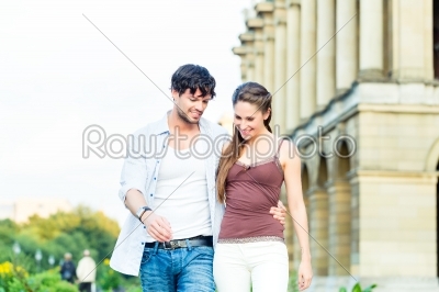 Tourist couple in city walking