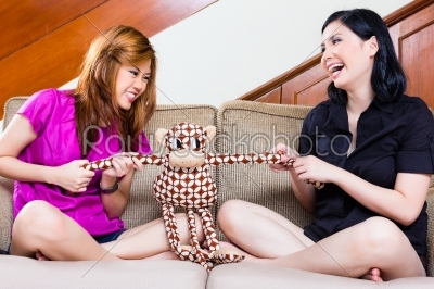 Two asian girls at home