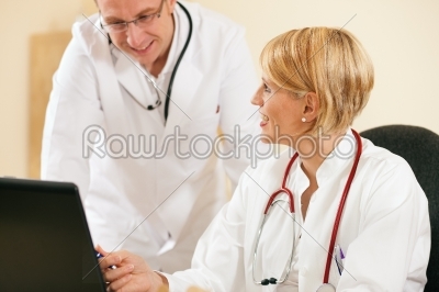 Two doctors discussion documents or test results