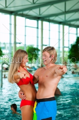 Two friends in public swimming pool