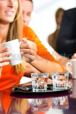 Two glasses of water placed on a tray