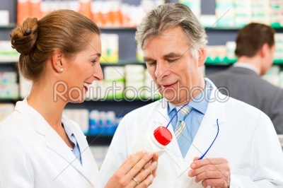 Two pharmacists in pharmacy consulting
