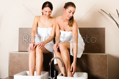 Two women taking a footbath