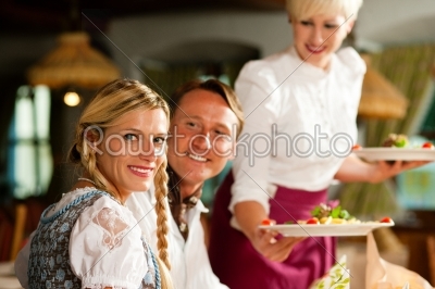 Waitress serving an Bavarian Restaurant