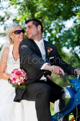 Wedding couple on a motorbike
