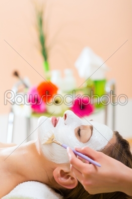 Wellness - woman getting face mask in spa
