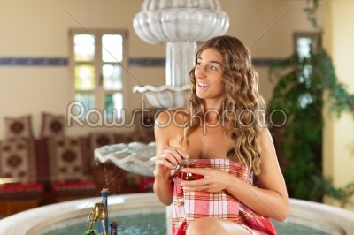 Wellness - woman is relaxing in relaxation room