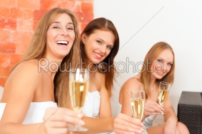 Wellness - women drinking champagne in spa