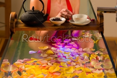 Woman bathing in spa with color therapy