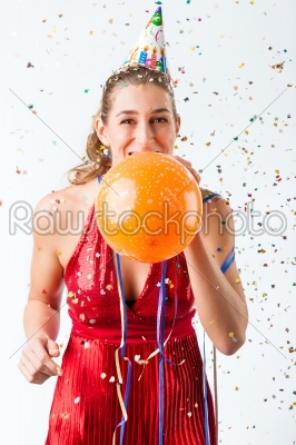 Woman celebrating birthday with balloon