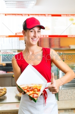 Woman eating a slice of pizza