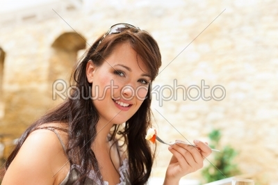 Woman eating food in the afternoon