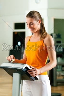 Woman exercising with modern key system