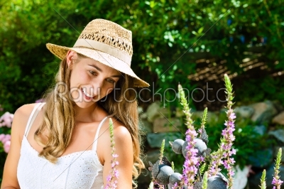Woman gardener standing in the garden 